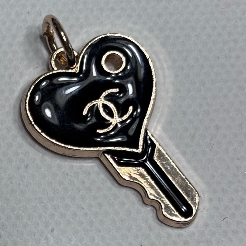 Black and Gold CC key charm comes with a chain